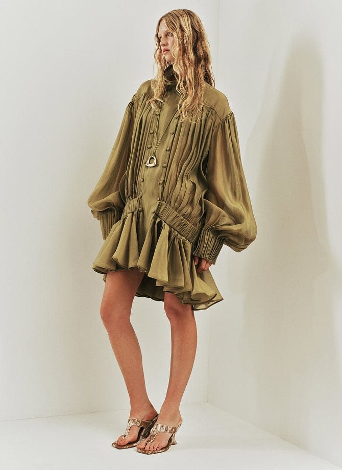 Aje campaign: an olive pleated dress
